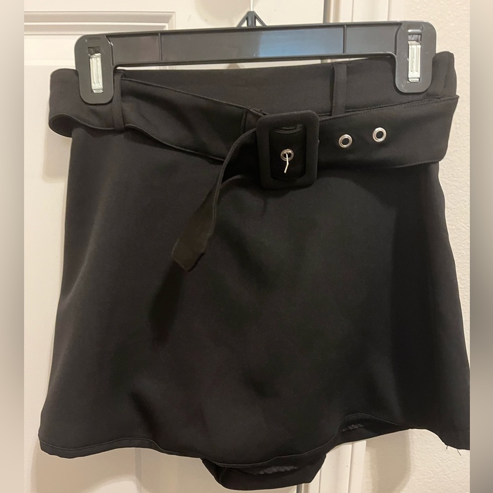 I am selling a super cute black skort from Dee Dee! Never been worn!